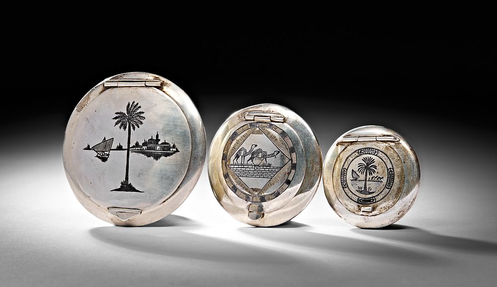 Lot 231: THREE CIRCULAR 20TH CENTURY IRAQI SILVER AND NIELLO CASES