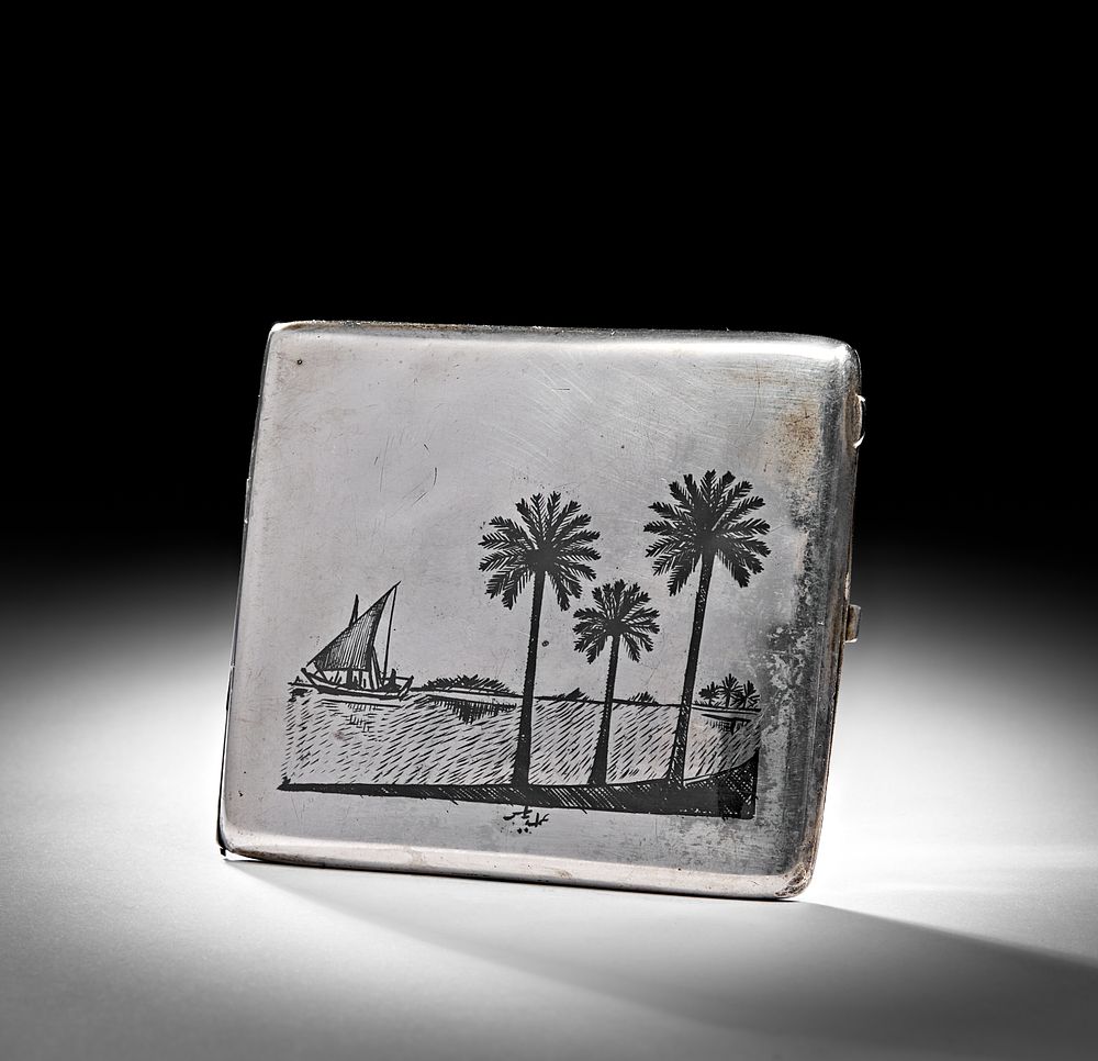 Lot 233: A 20TH CENTURY IRAQI SILVER AND NIELLO CIGARETTE CASE