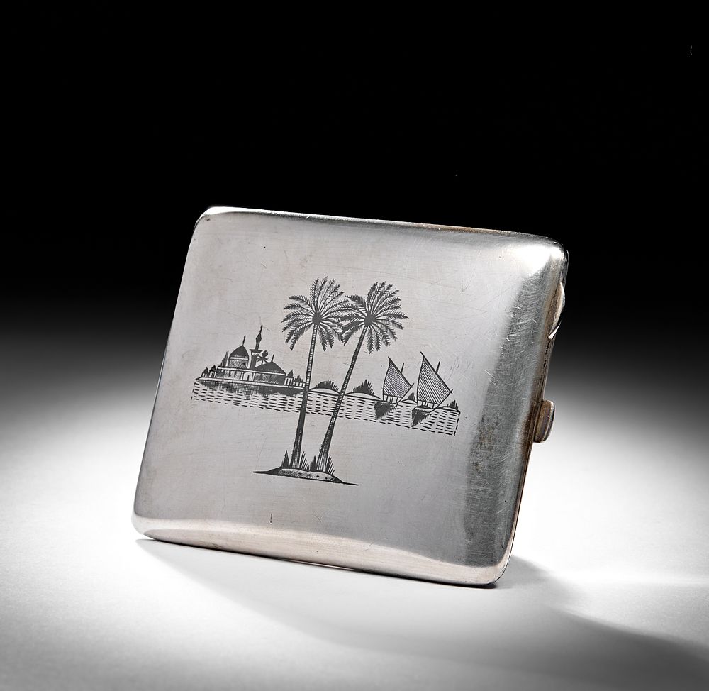 Lot 235: A 20TH CENTURY IRAQI SILVER AND NIELLO CIGARETTE CASE
