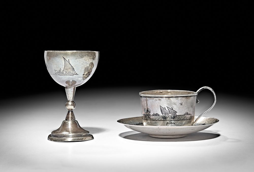 Lot 240: AN EARLY 20TH CENTURY IRAQI SILVER AND NIELLO COFFEE CUP, SAUCER AND EGG CUP