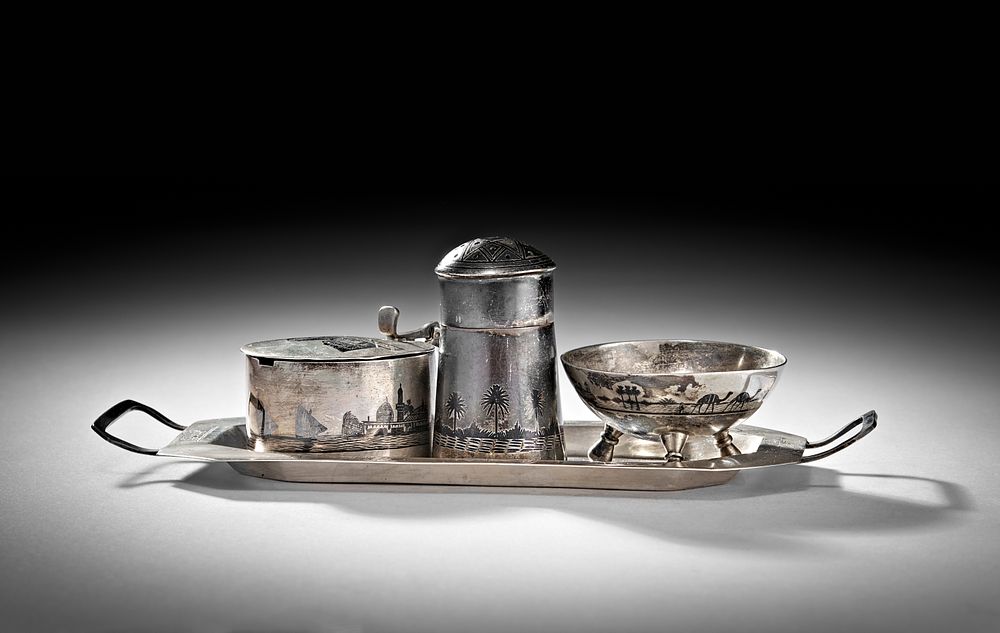 Lot 248: A 20TH CENTURY IRAQI SILVER AND NIELLO CRUET ON TRAY