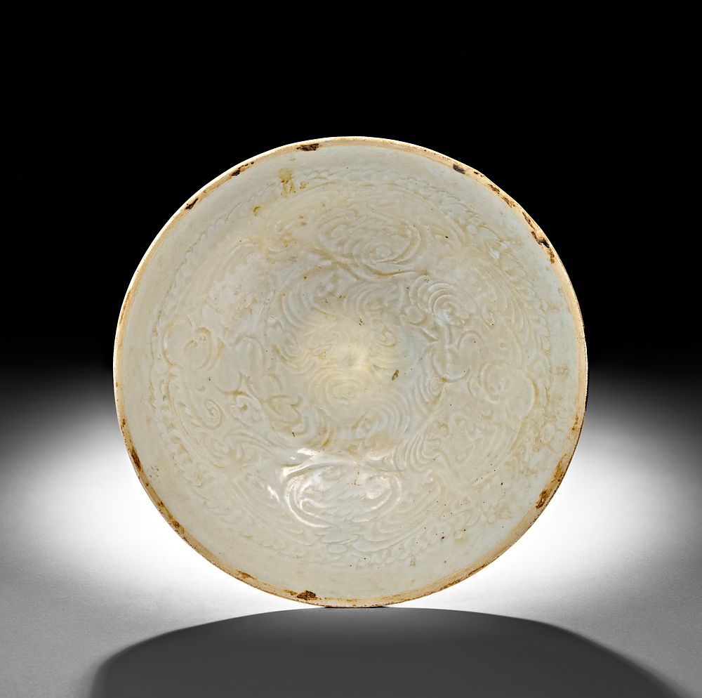 Lot 269: A CHINESE QINGBAI MOULDED BOWL, SONG DYNASTY (960-1279 AD)