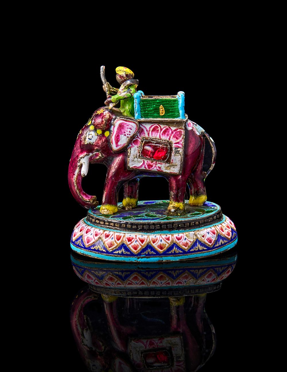 Lot 172: AN ENAMELLED INDIAN SILVER CHESS PIECE IN THE FORM ON AN ELEPHANT, POSSIBLY LUCKNOW