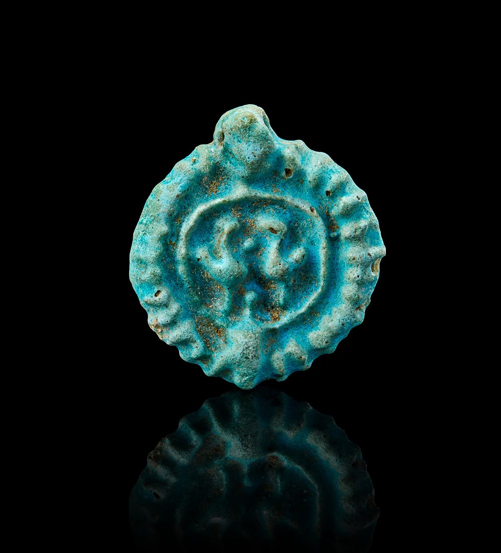 Lot 174: A SELJUK KASHAN TURQUOISE POTTERY PENDANT, PERSIA, 12TH - 13TH CENTURY