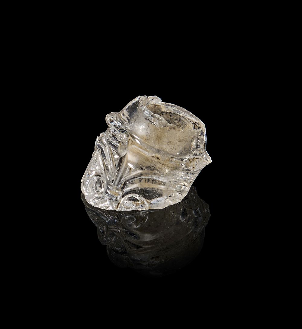 Lot 176: A FATIMID CARVED ROCK CRYSTAL FRAGMENT FROM A PERFOM BOTTLE, 11TH - 12TH CENTURY