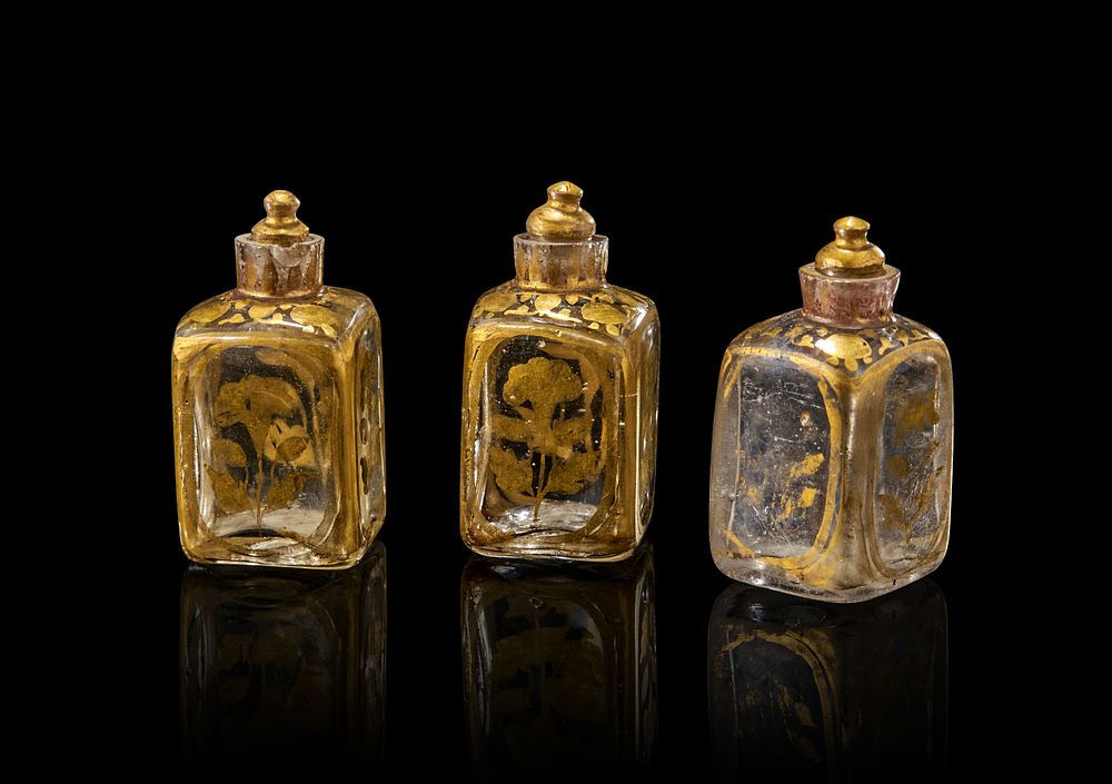 Lot 177: A GROUP OF THREE MUGHAL GILT GLASS PERFUME BOTTLES, GUJARAT, 18TH CENTURY