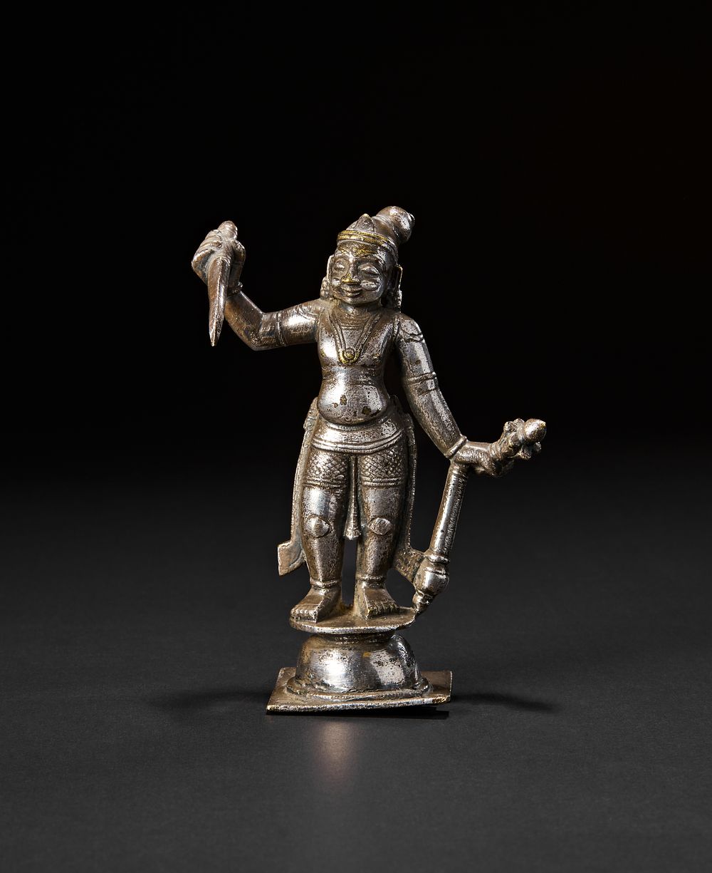 Lot 188: A SILVER OVERLAID BRONZE OR BRASS FIGURE OF A MALE DEITY, SOUTH INDIAN, 18TH CENTURY