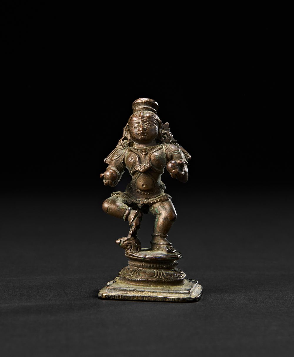 Lot 196: A SOUTH INDIAN BRONZE FIGURE OF KRISHNA THE BUTTER THIEF, 18TH CENTURY