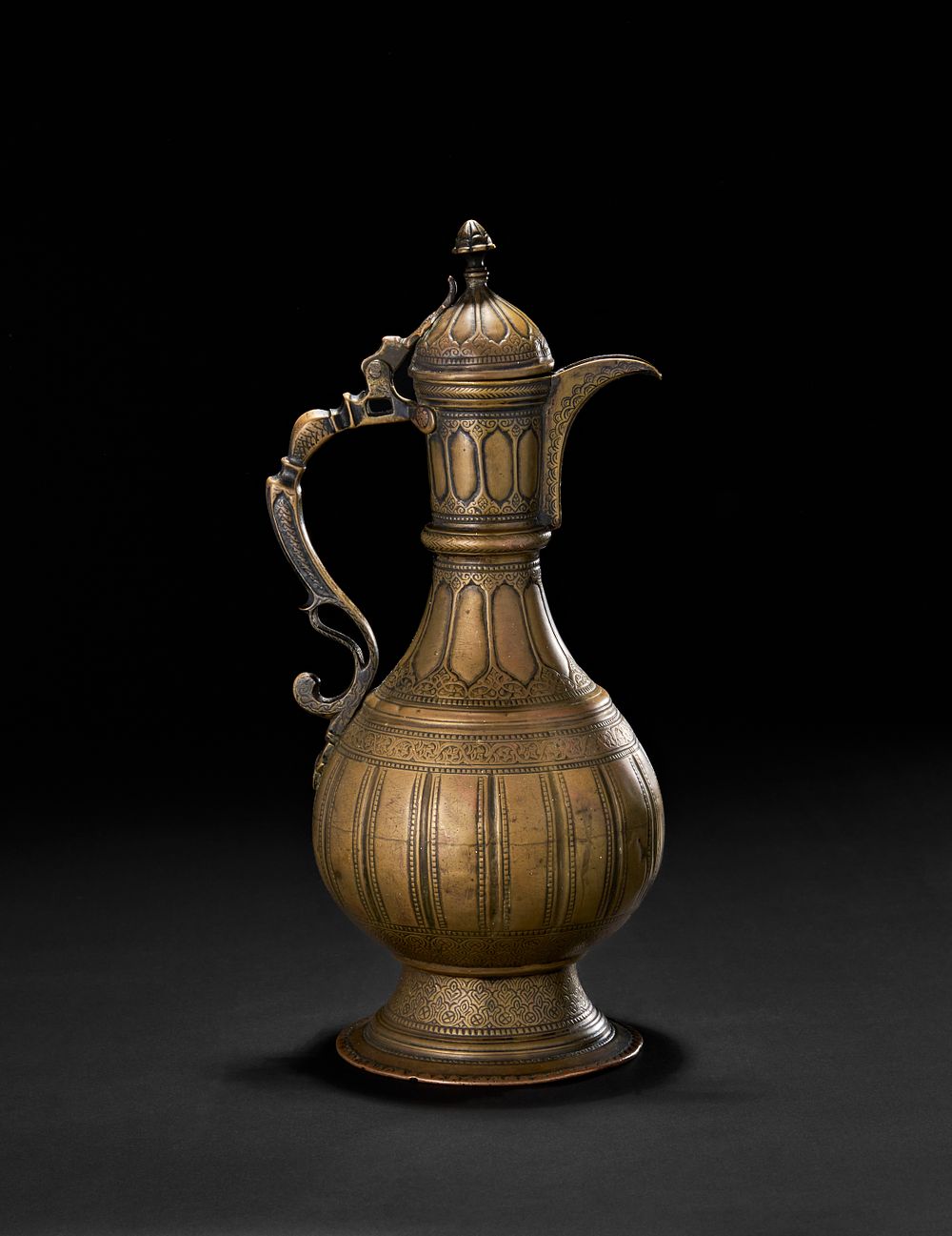 Lot 207: A BRASS ENGRAVED EWER SIGNED BY MASTER AHMED, CENTRAL ASIAN BUKHARA, 19TH CENTURY