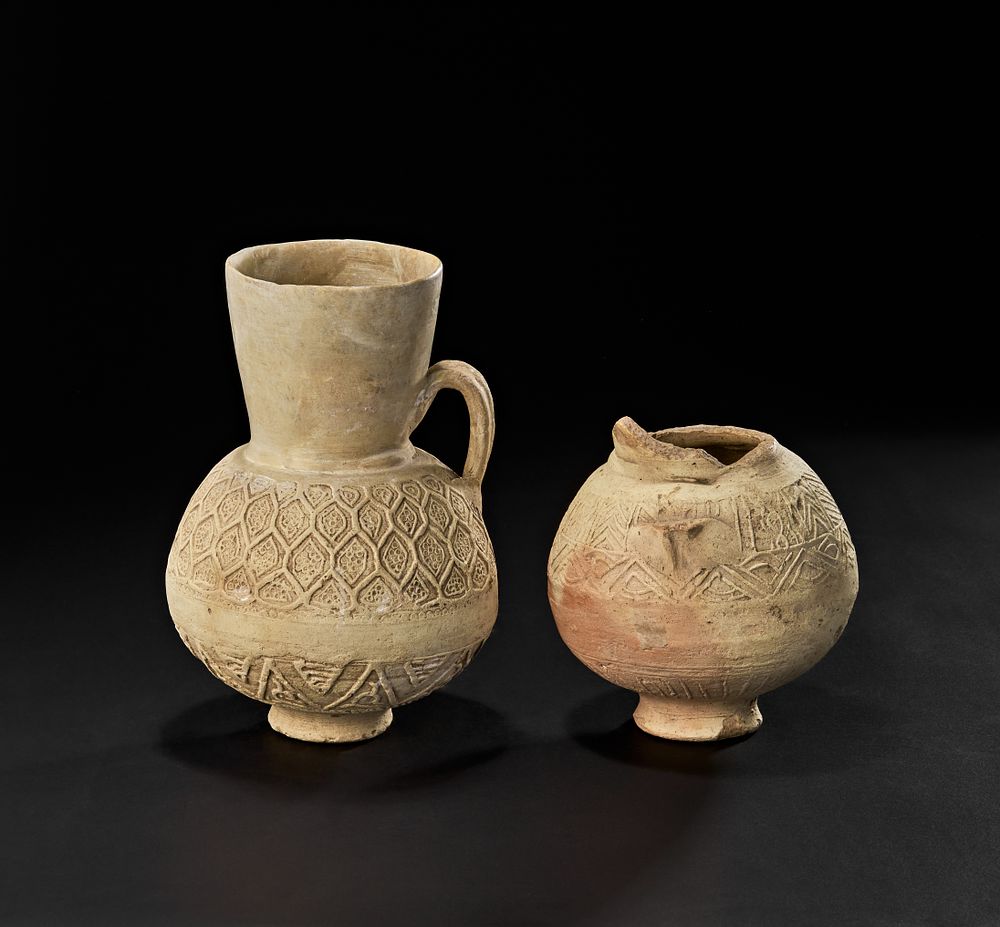 Lot 213: TWO WHITE FATIMID UNGLAZED POTTERY JUGS, EGYPT OR SYRIA,  11TH - 12TH CENTURY