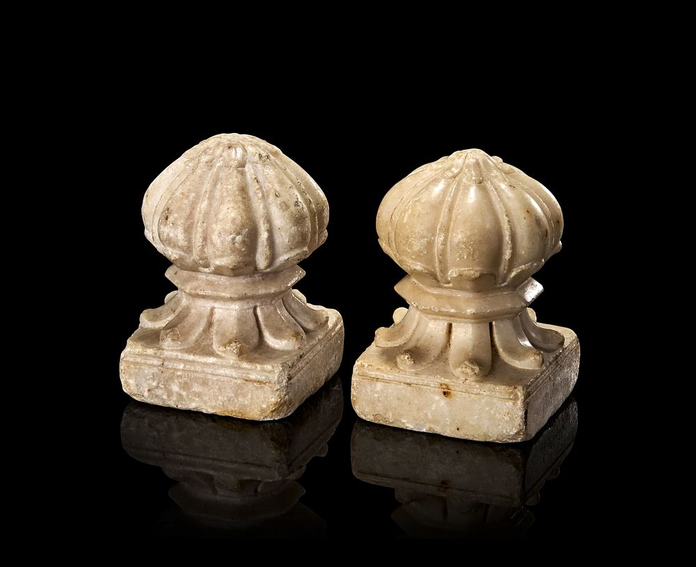 Lot 225: A PAIR OF MUGHAL WHITE MARBLE CARPET WEIGHTS, NORTH INDIA, 18TH - 19TH CENTURY