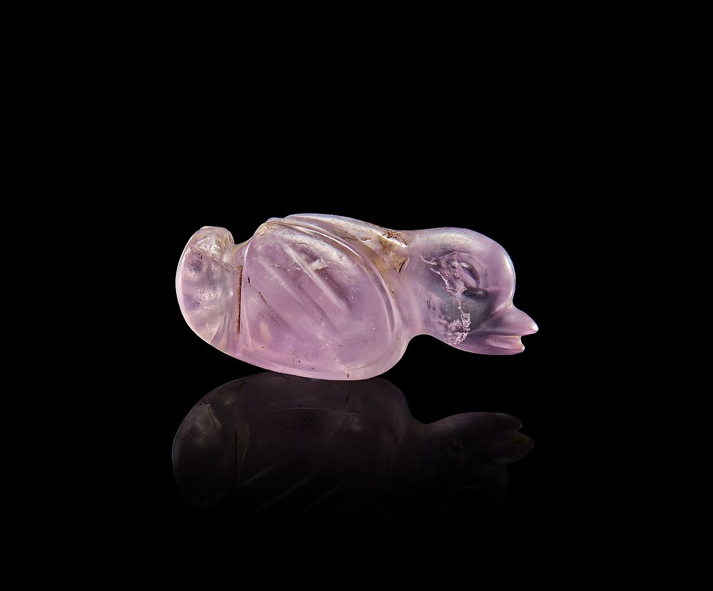 Lot 68: AN AMETHYST DUCK AMULET, GREEK OR ROMAN PERIOD