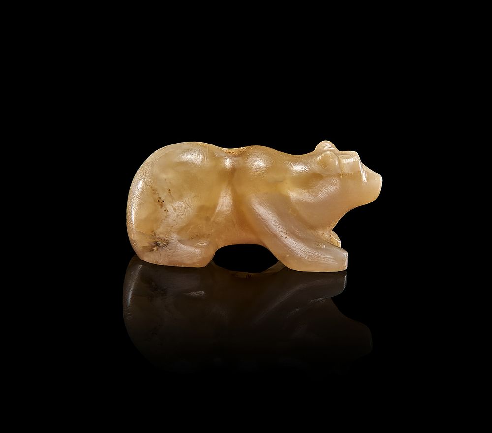 Lot 77: A GREEK CHALCEDONY AGATE OF A STANDING BEAR, HELLENISTIC PERIOD