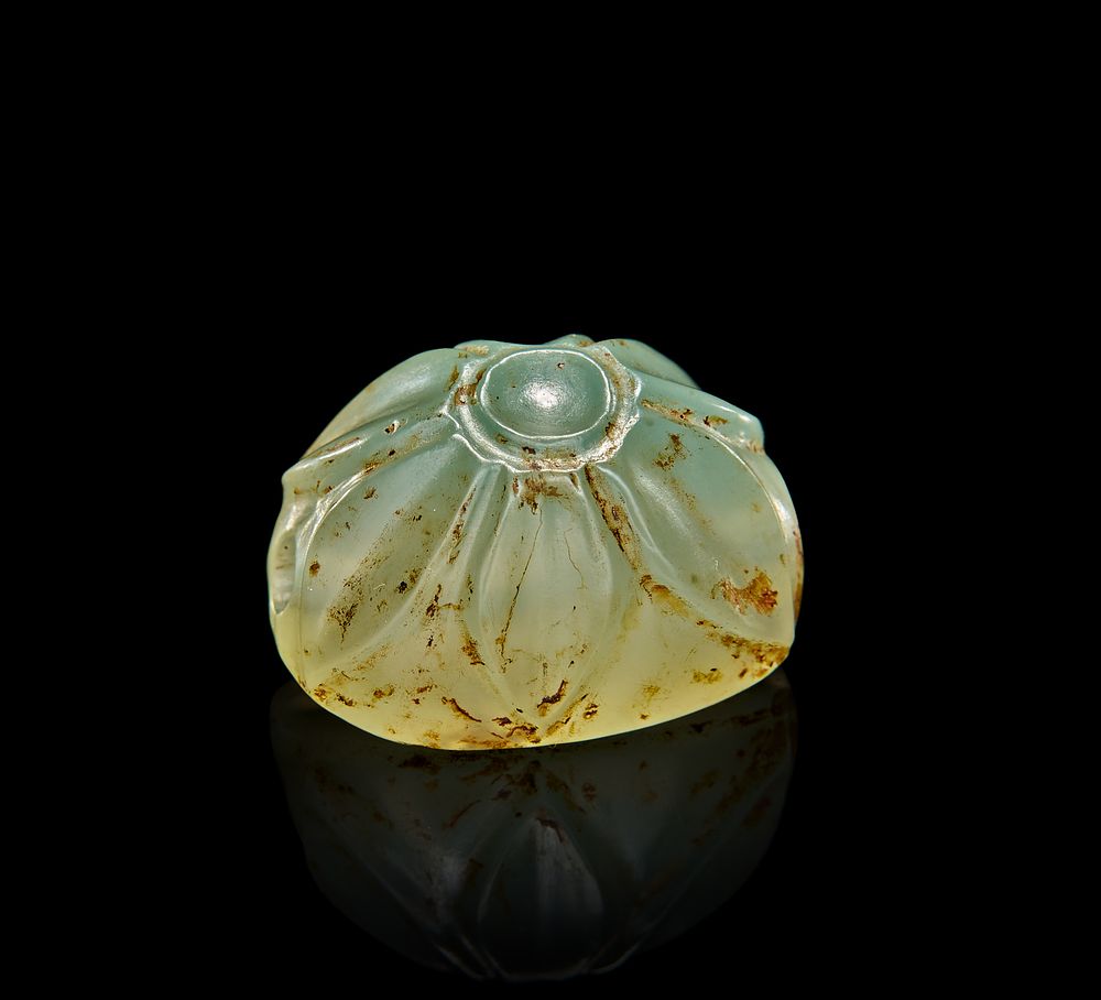 Lot 80: A JADE PENDANT BEAD IN THE FORM OF A LOTUS FLOWER, PERSIAN PERIOD EGYPT