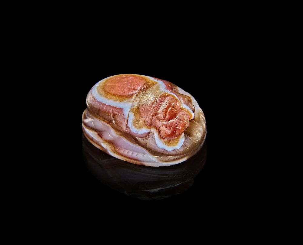 Lot 83: A BANDED AGATE ARCHAIC GREEK SCARABIOD, 600-500 B.C.