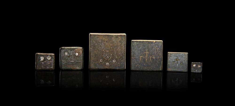 Lot 92: A COMPLE SET OF SILVER INLAID BRONZE BYZANTINE WEIGHTS, 600 - 800 A.D
