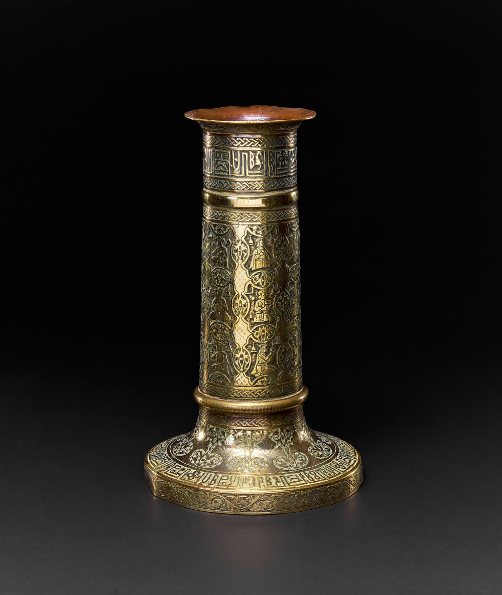 Lot 153: A QAJAR BRASS TORCH STAND, PERSIA, 19TH CENTURY