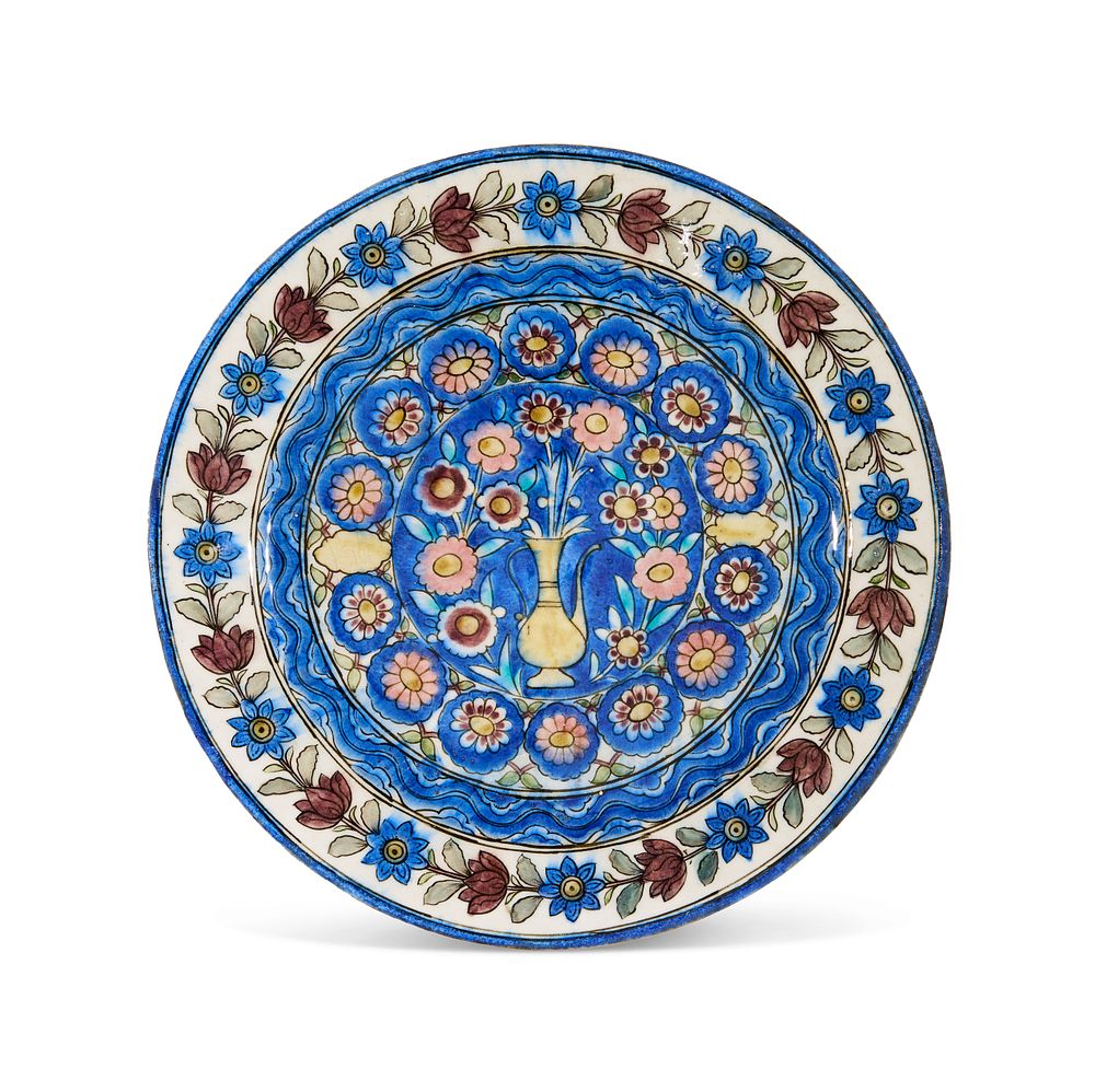 Lot 314: A FLORAL QAJAR POTTERY DISH, IRAN, 19TH CENTURY
