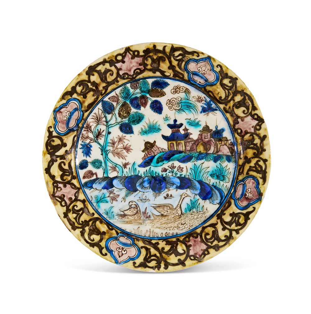 Lot 317: A QAJAR UNDERGLAZE PAINTED POTTERY DISH, PERSIA, 19TH CENTURY