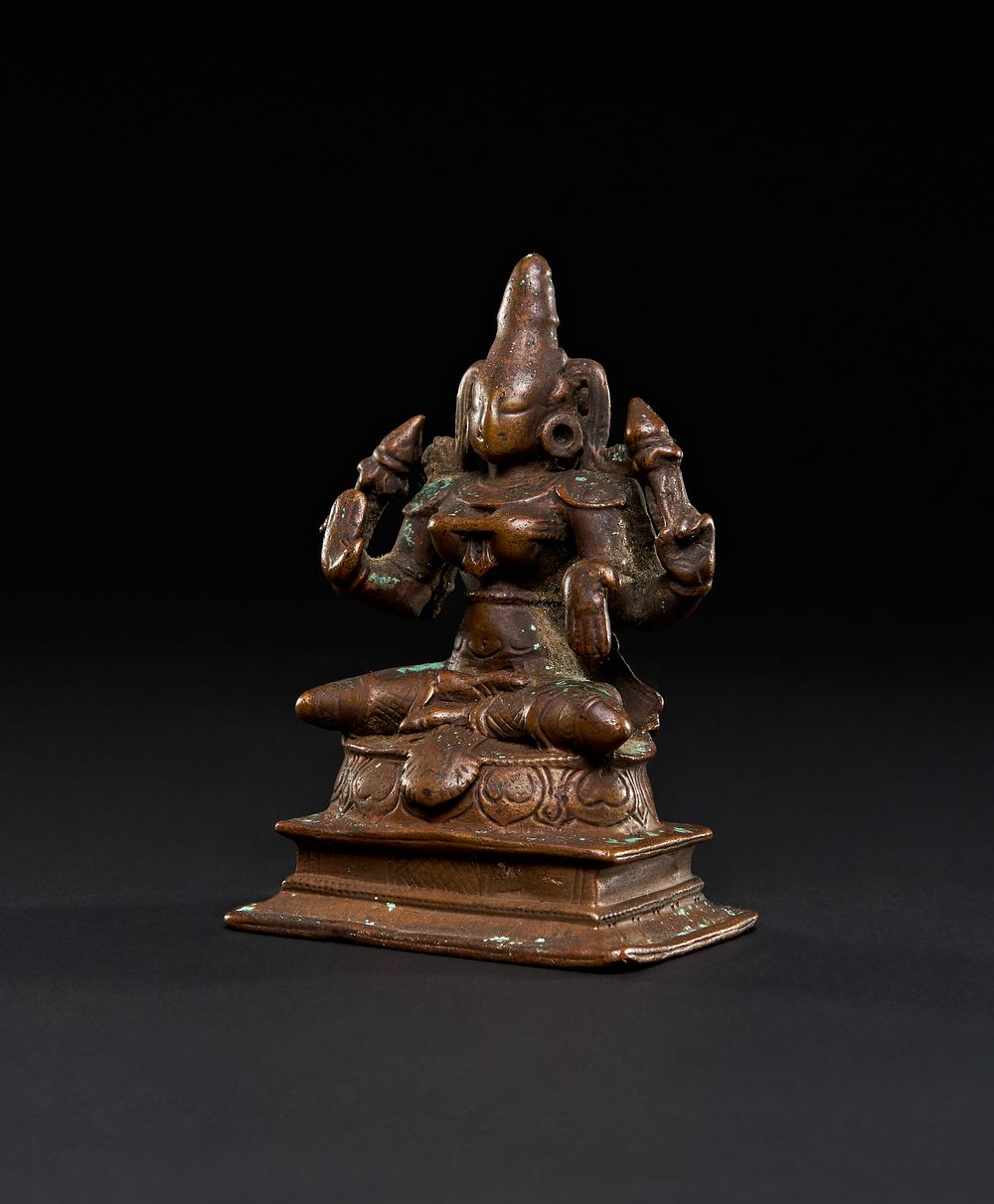 Lot 209: A BRONZE FIGURE OF A SEATED DEITY, SOUTH INDIA, 18TH CENTURY