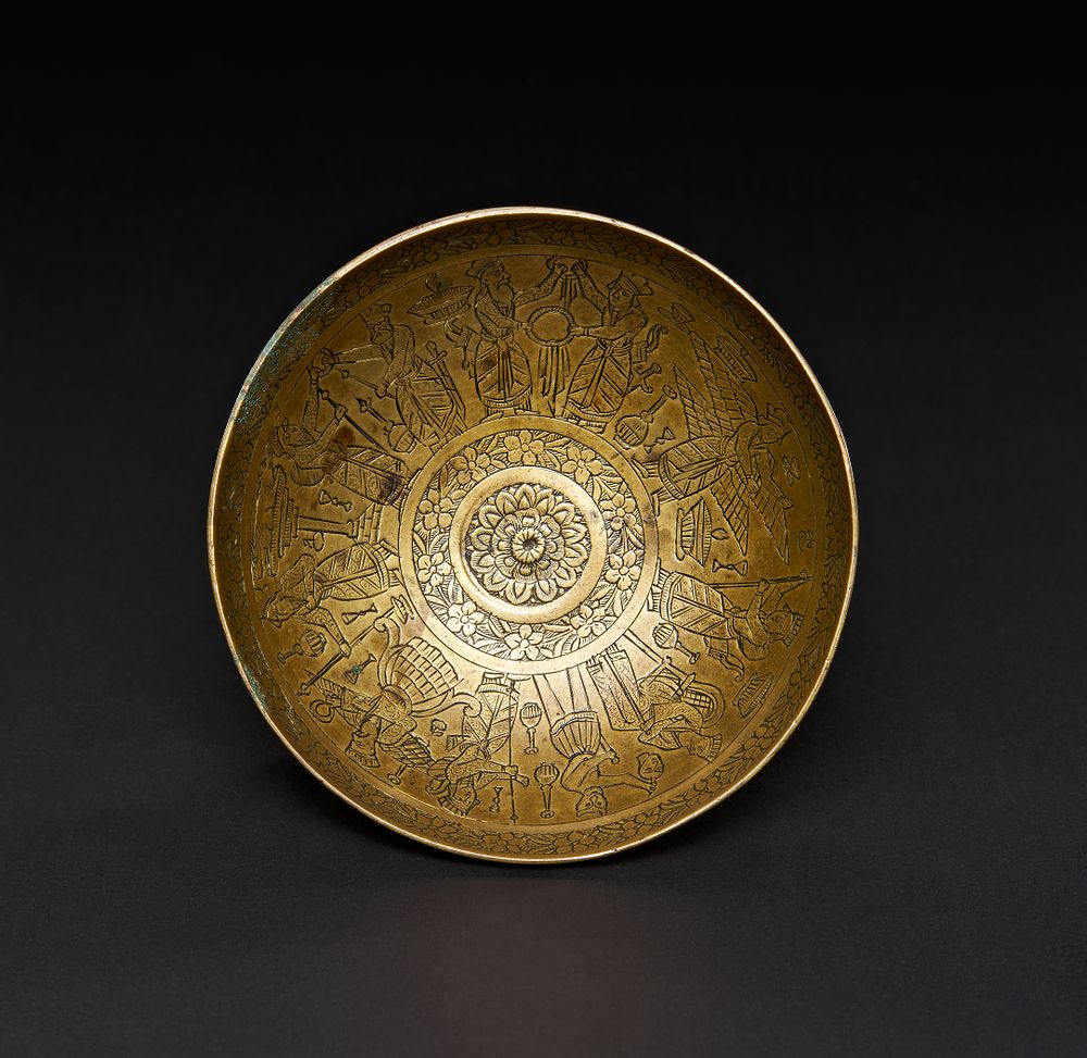 Lot 160: A QAJAR ENGRAVED BRASS DRINKING BOWL WITH ZAROSTRIAN SCENES, PERSIA, 19TH CENTURY