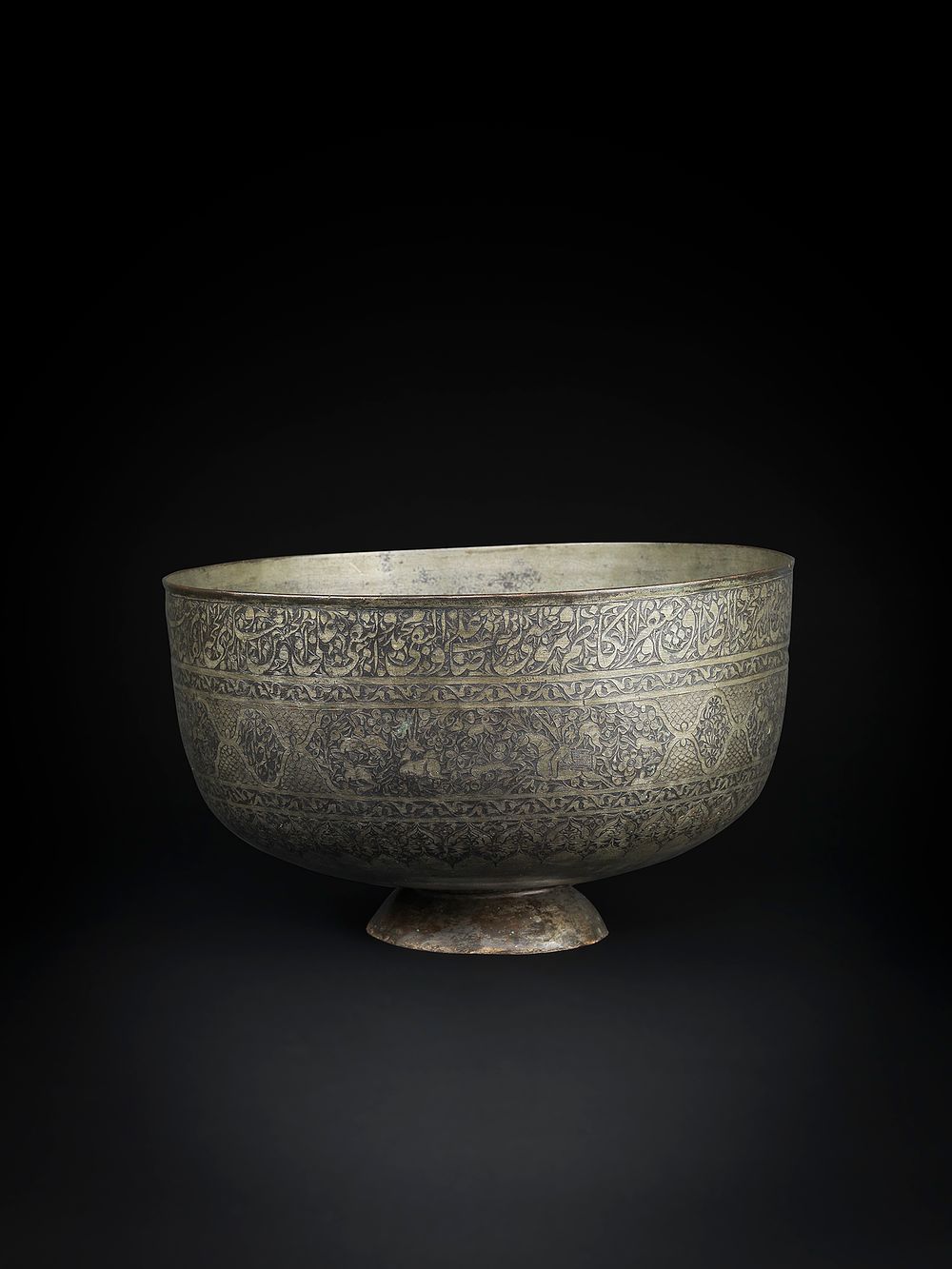 Lot 140: A QAJAR TINNED-COPPER BOWL BY GHULAM REZA, PERSIA, DATED AH 1224/ AD 1809-10