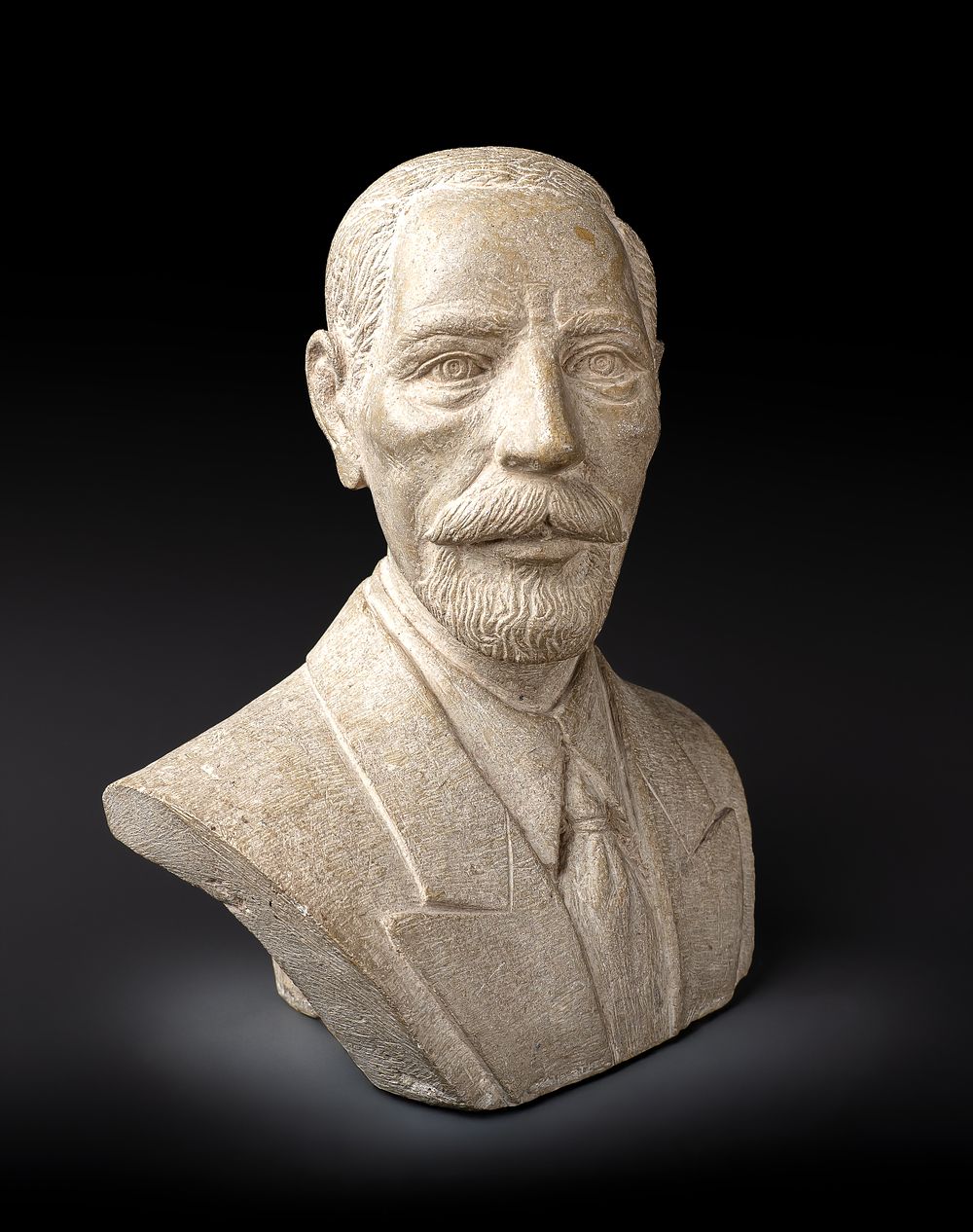 Lot 220: A STONE BUST DEPICTS KING FAISAL I OF IRAQ, EARLY 20TH CENTURY ROYAL PORTRAIT SCULPTURE