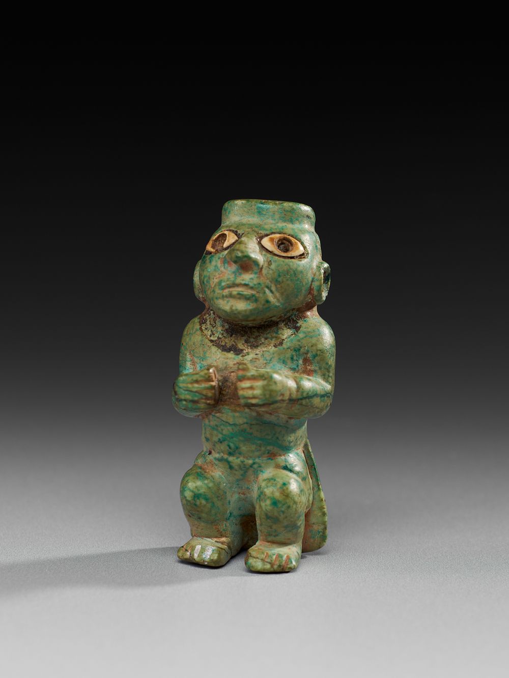Lot 217: A CARVED GREEN STONE FIGURE, POSSIBLY SOUTH AMERICAN