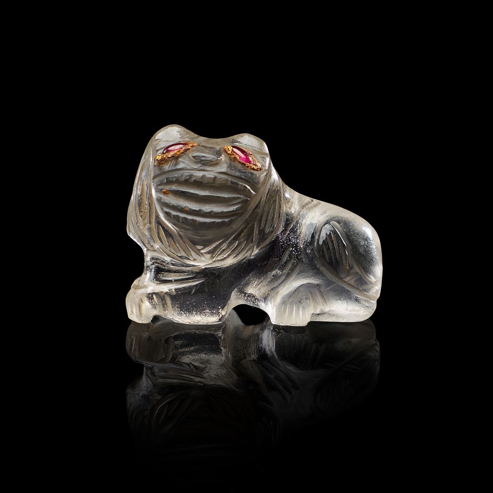 Lot 211: AN INDIAN ROCK CRYSTAL FIGURE IN THE FORM OF A LION WITH RUBY EYES, 19TH - 20TH CENTURY
