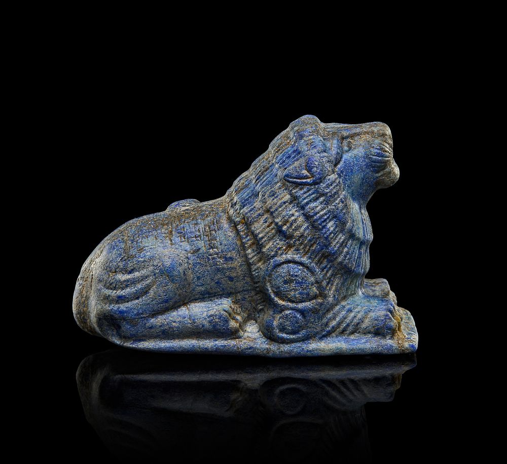 Lot 238: A LAPIS LAZULI SEATED LION INSCRIBED WITH CUNEIFORM, EARLY NEO BABYLONIAN OR EARLY NEO ASSYRIAN PERIOD, 800-600 B.C