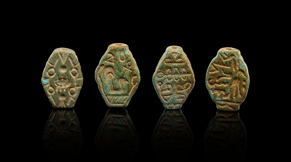 Lot 239: A GROUP OF EGYPTIAN FAIENCE AMULETS