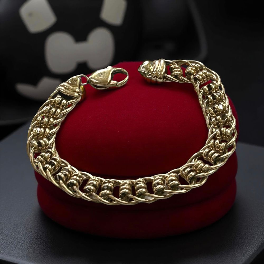 Lot 352: 9ct Gold fancy link bracelet.