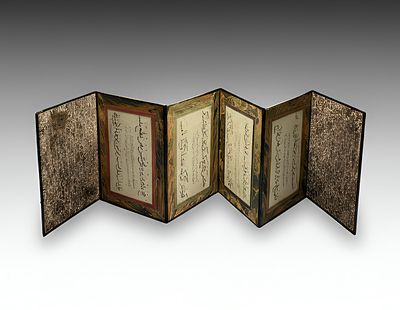 AN OTTOMAN CHALLIGRAPHIC ALBUM IN CONCERTINA FORM, SIGNED HASSAN AND DATED. A beautifully 