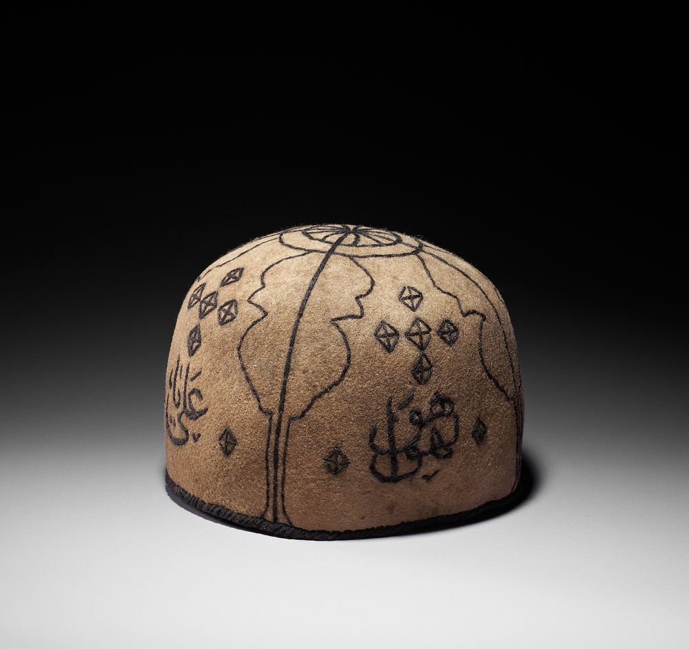 Lot 157: A QAJAR FELT DERVISH HAT, LATE 19TH CENTURY