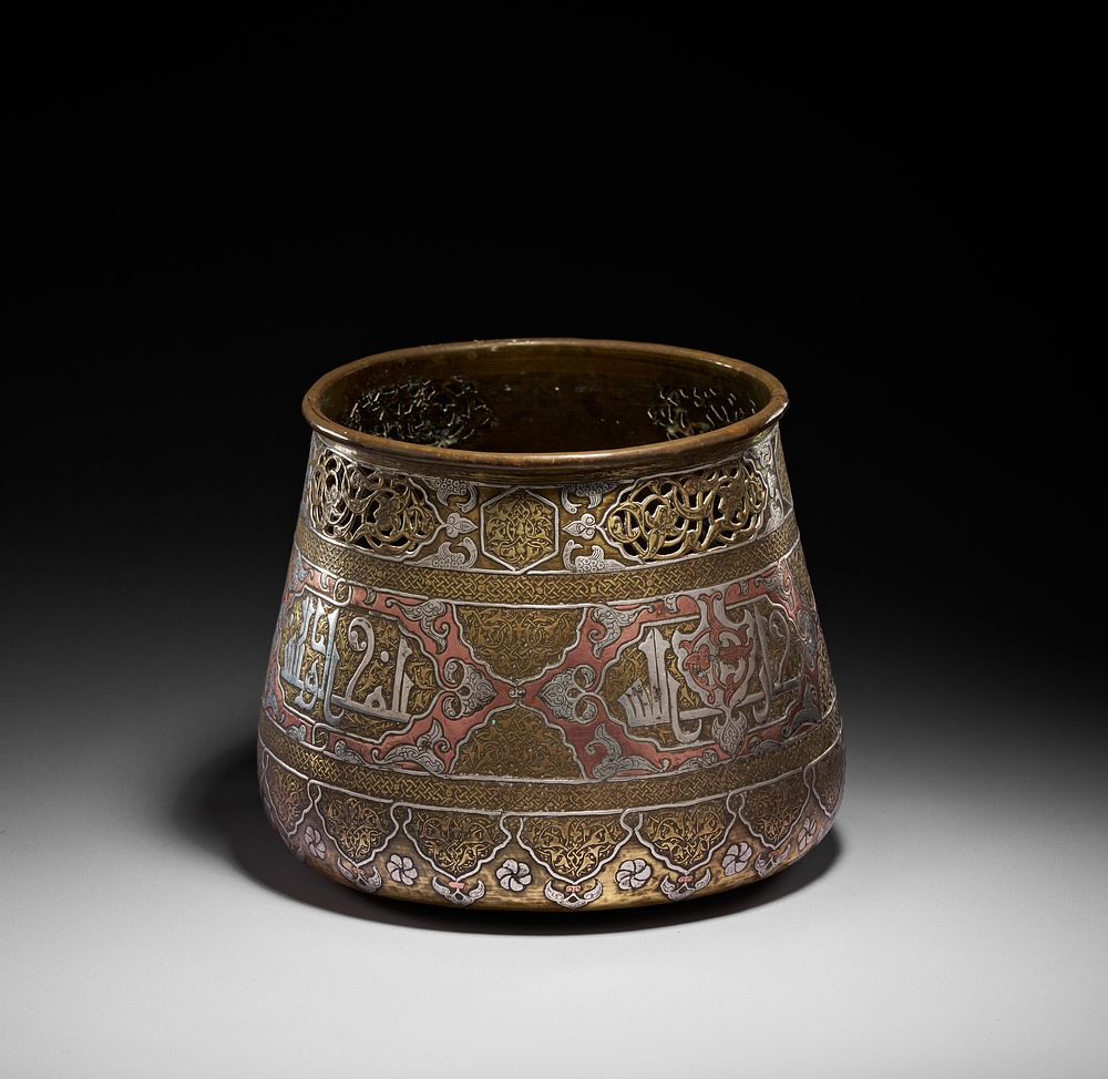 Lot 169: A DAMASCENE SILVER AND COPPER INLAID ON BRASS POT/BOWL, SYRIA, CIRCA 1900