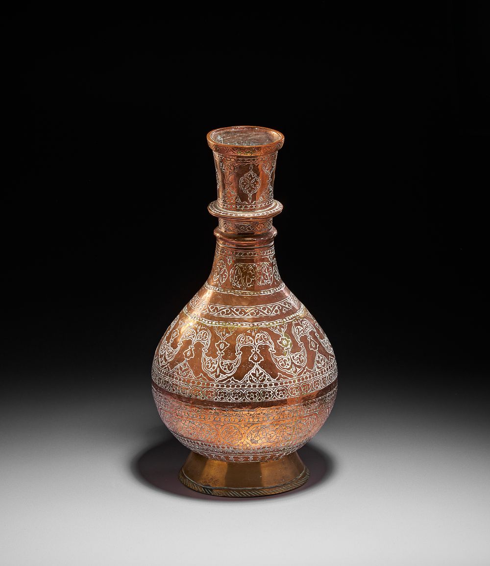 Lot 173: AN ENGRAVED COPPER VASE, NORTH INDIA, 19TH CENTURY