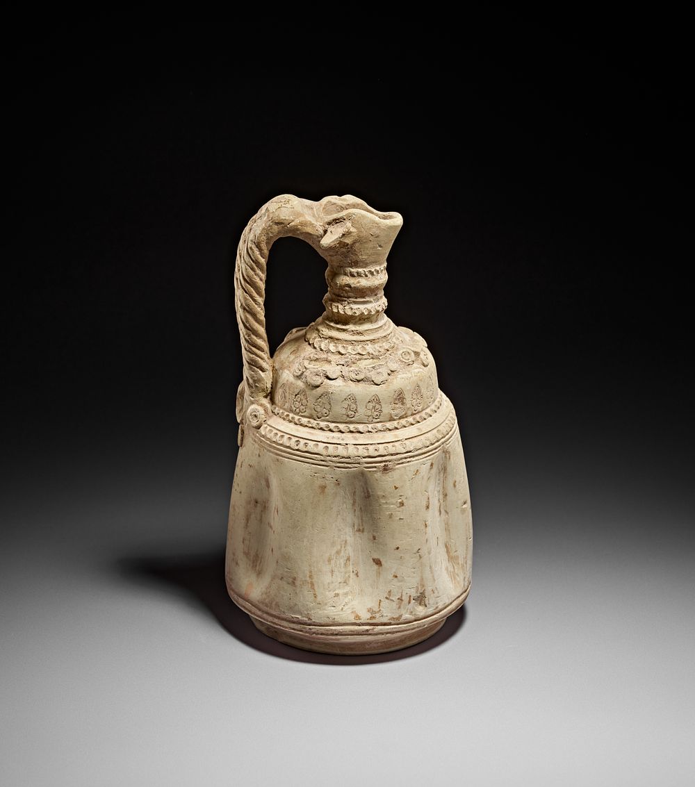 Lot 180: AN ABBASID MOULDED POTTERY EWER, MESOPOTAMIA, 8TH - 9TH CENTURY