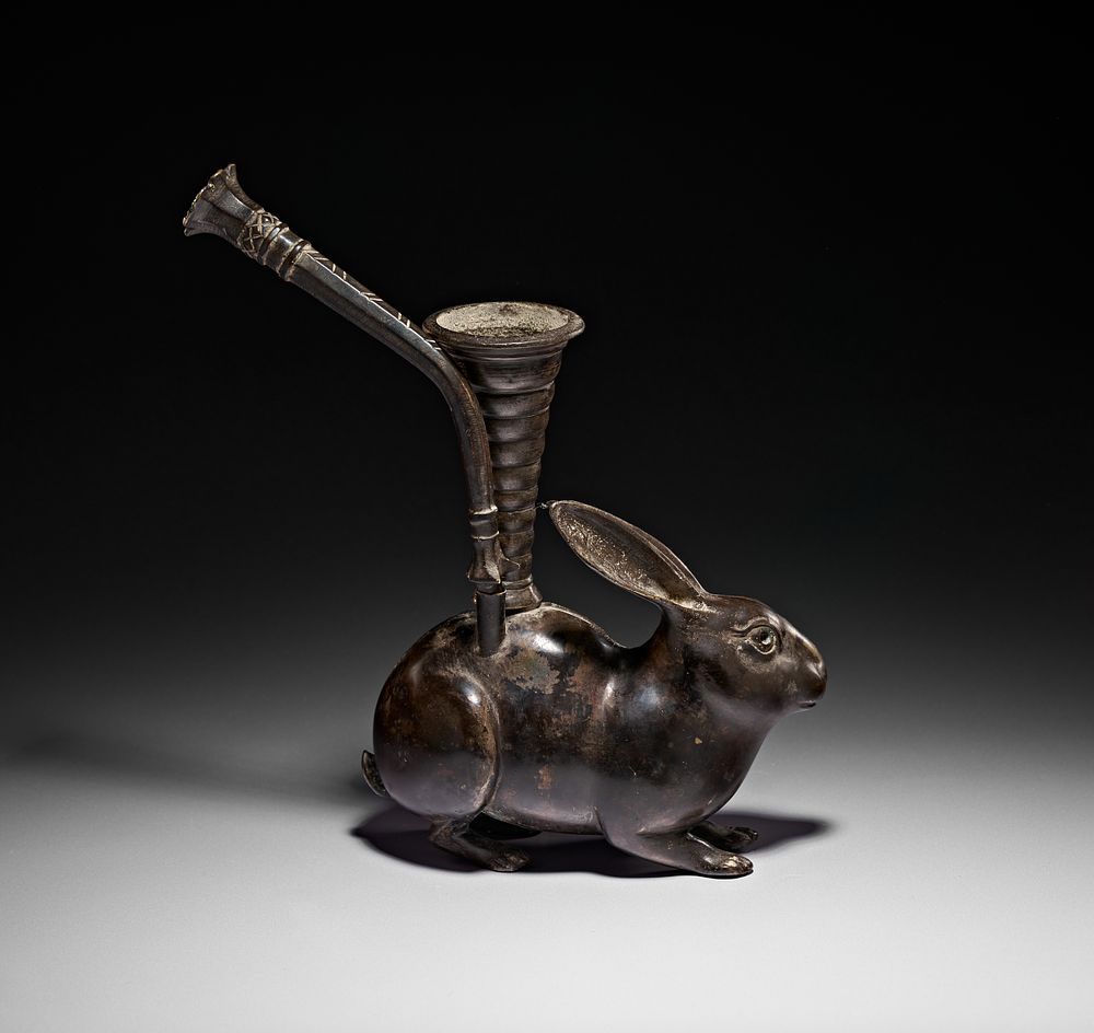 Lot 195: AN UNUSUAL INDIAN BRASS OR BRONZE HOOKAH BASE IN THE FORM OF A RABBIT, 19TH CENTURY