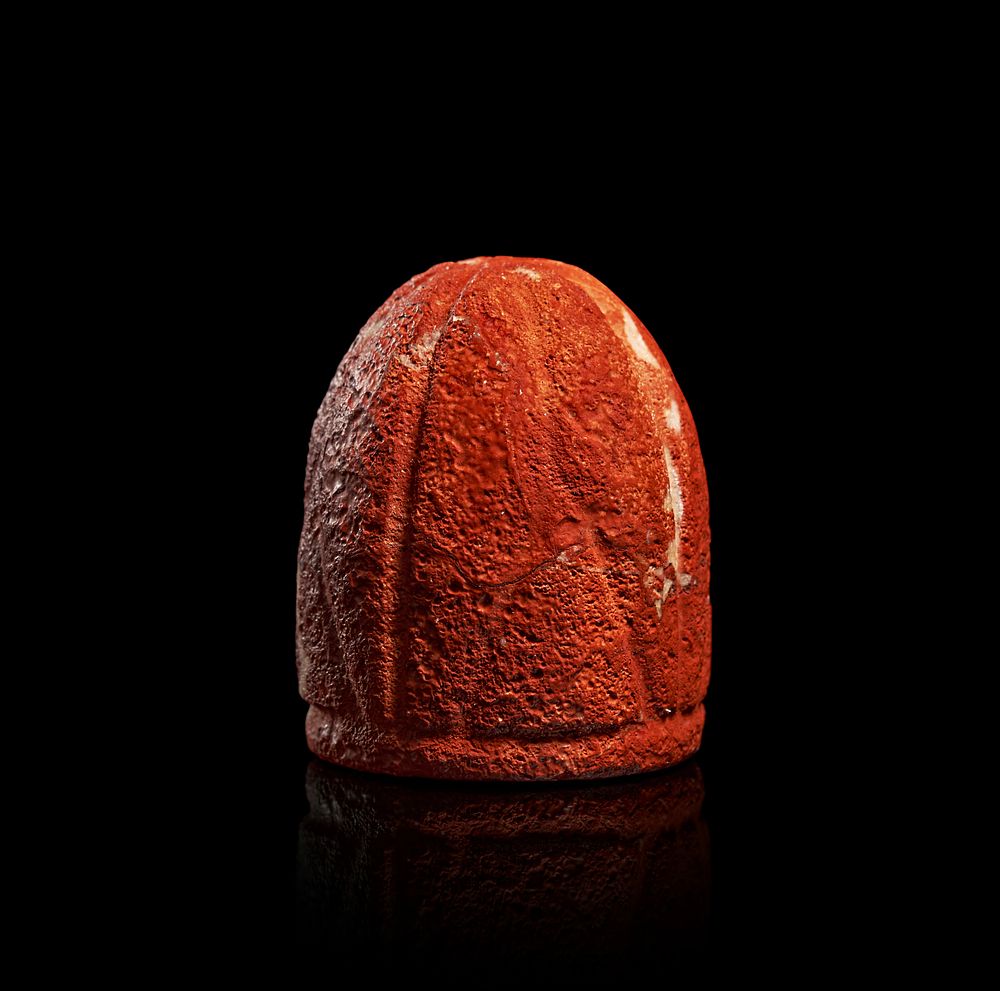 Lot 205: A RED INDIAN STONE CHESS/GAME PIECE, MUGHAL, 17TH - 18TH CENTURY