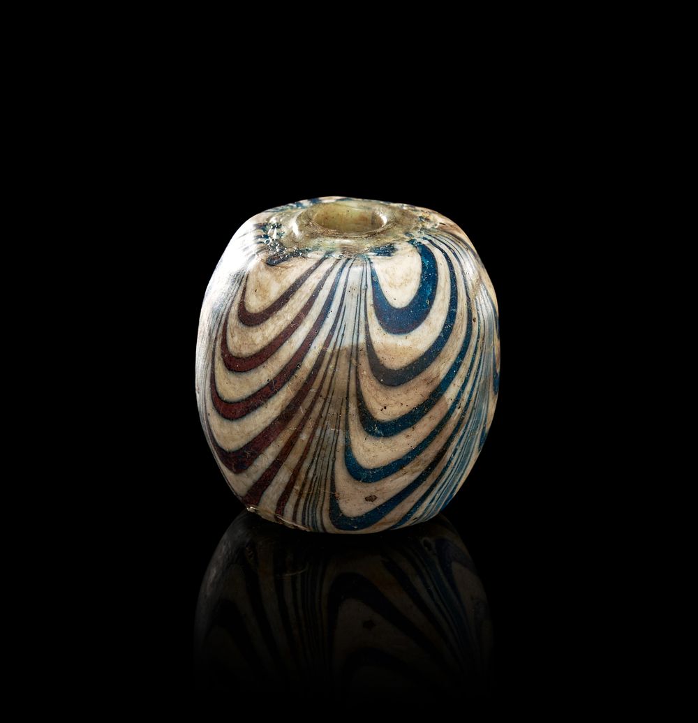 Lot 204: A LARGE MARVERED GLASS BEAD, JAVA, 10TH - 12TH CENTURY