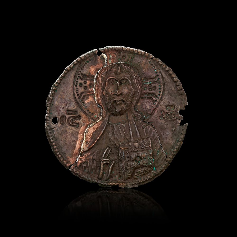 Lot 207: A METAL BYZANTINE PLAQUE DEPICTS CHRIST, CIRCA 7TH CENTURY A.D
