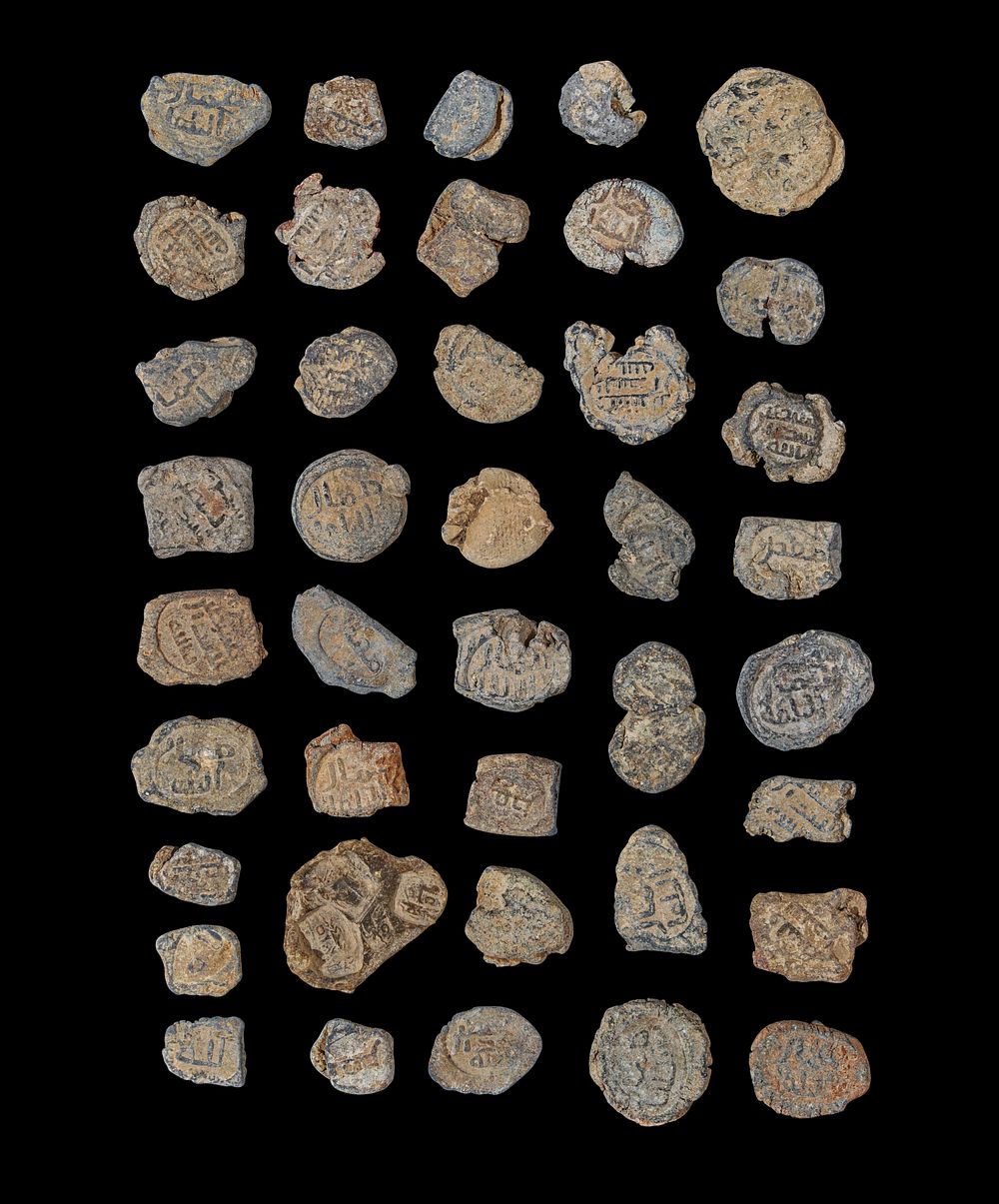 Lot 221: A LARGE COLLECTION OF LEAD ABBASID PERSONAL/OFFICIAL SEALS, 8TH CENTURY A.D.