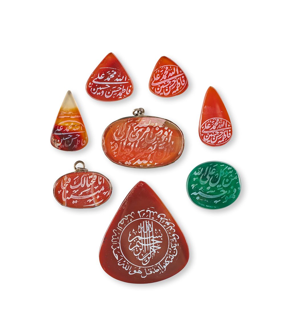 Lot 294: A COLLECTION OF ISLAMIC GLASS AND AGTE AMULETS/PENDANT, PERSIA, 19TH - 20TH CENTURY