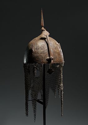 AN ENGRAVED PERSIAN HELMET (KHULA KHUD) WITH CENTRAL SPIKE AND CHAIN MAIL, QAJAR, 19TH CENTURY . 