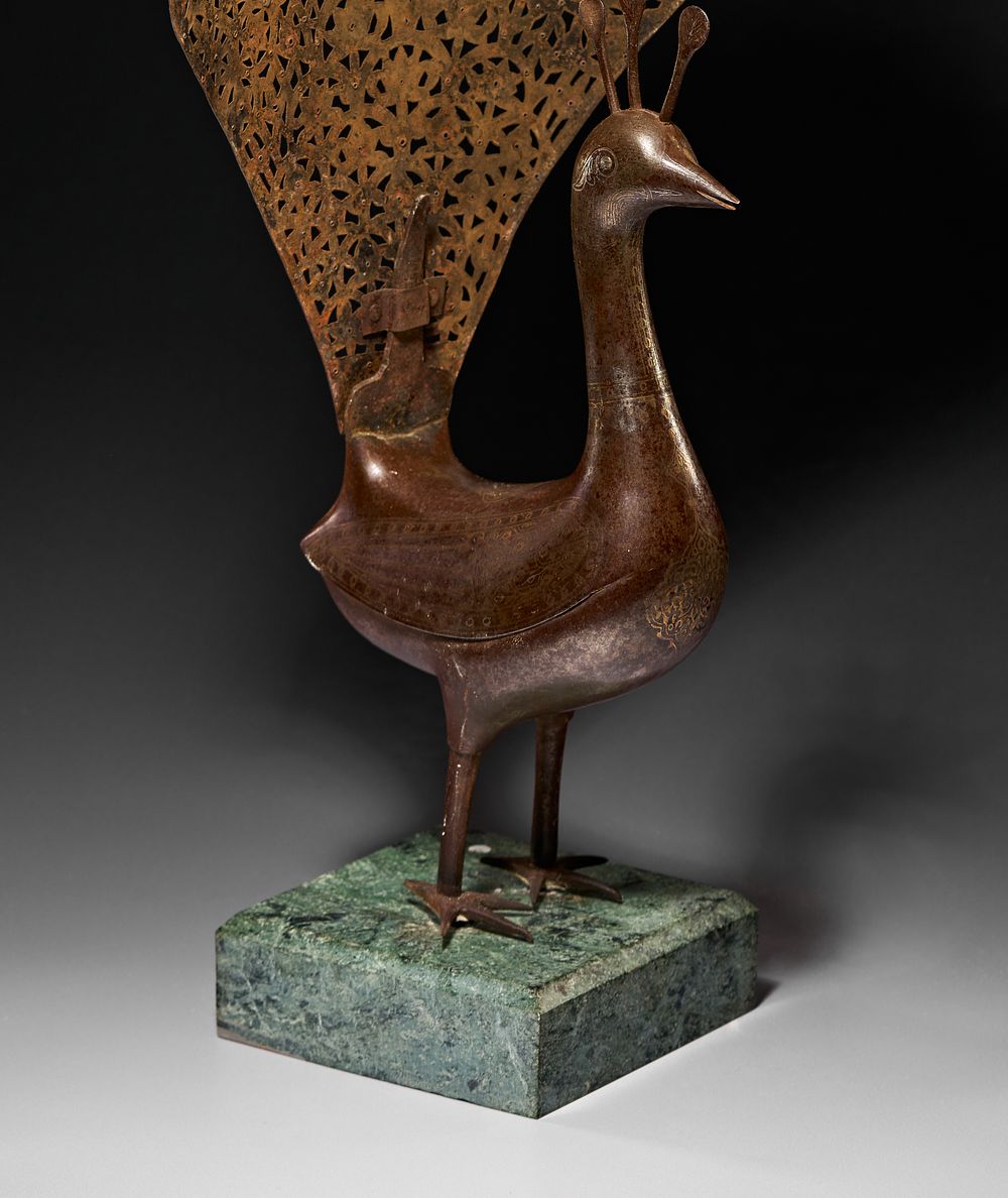 Lot 259: A STEEL QAJAR FIGURE OF A PEACOCK, PERSIA, 19TH CENTURY