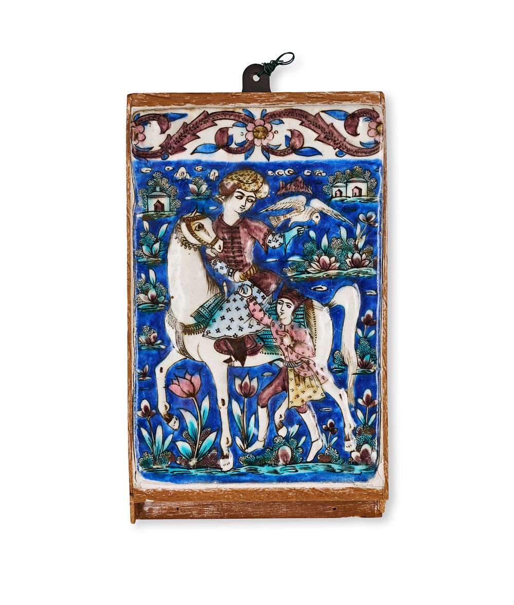 Lot 296: A QAJAR UNDERGLAZE PAINTED MOULDED POTTERY TILE, PERSIA, 19TH CENTURY
