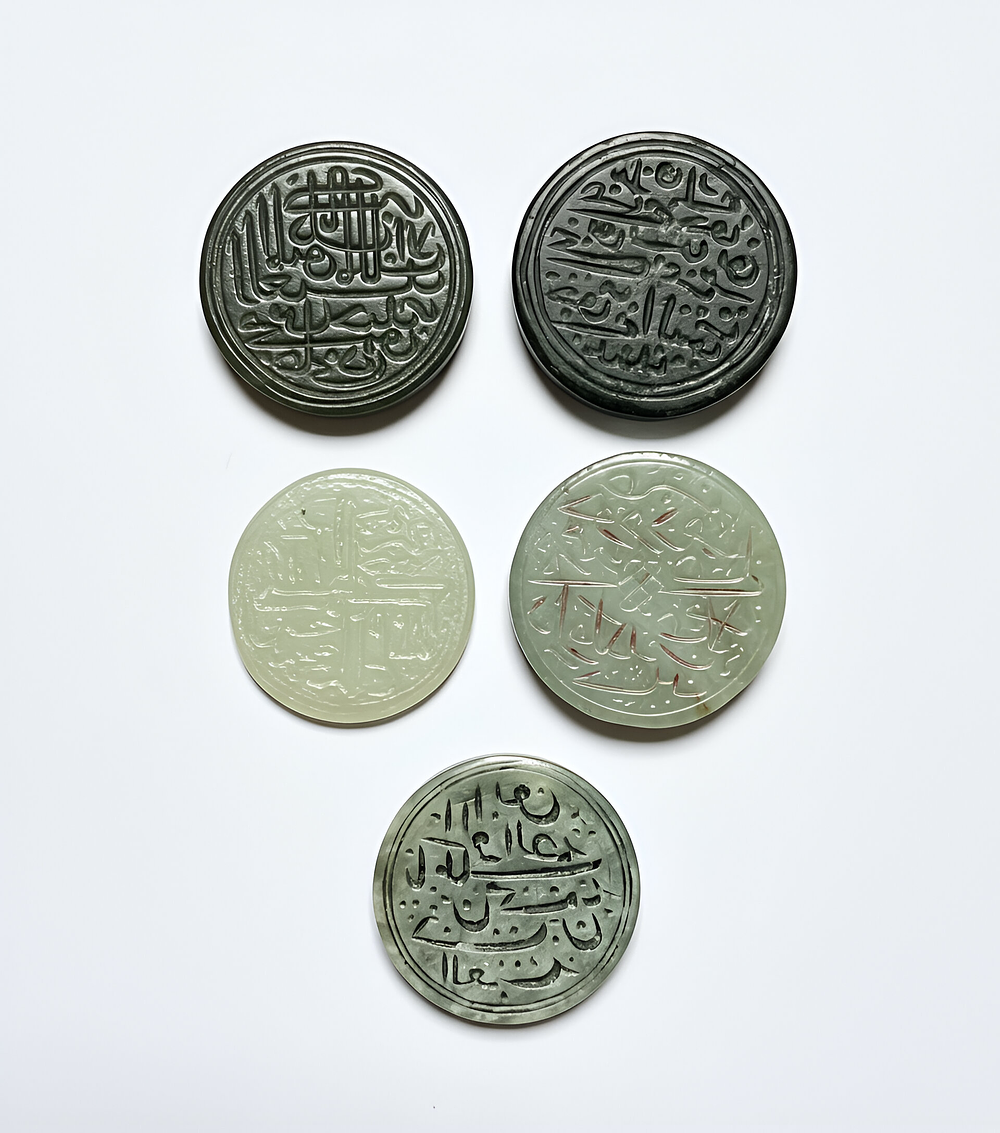 Lot 291: A GROUP OF FIVE TIMURID ENGRAVED JADE SEALS, PERSIA, 14TH-15TH CENTURY