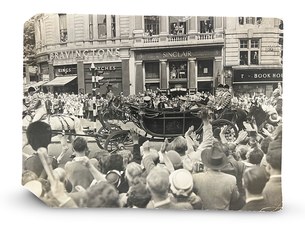Lot 219: A BLACK AND WHITE PHOTOGRAPH OF KING FAISAL II OF IRAQ WITH QUEEN ELIZABETH II, 20TH CENTURY