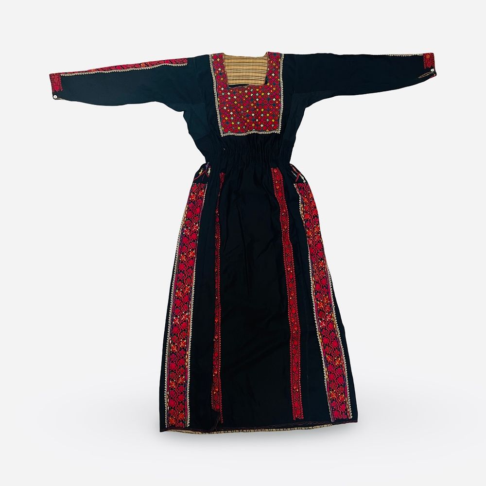 Lot 70: A TRADITIONAL HAND-EMBROIDERED PALESTINIAN THOBE DRESS, 20TH CENTURY