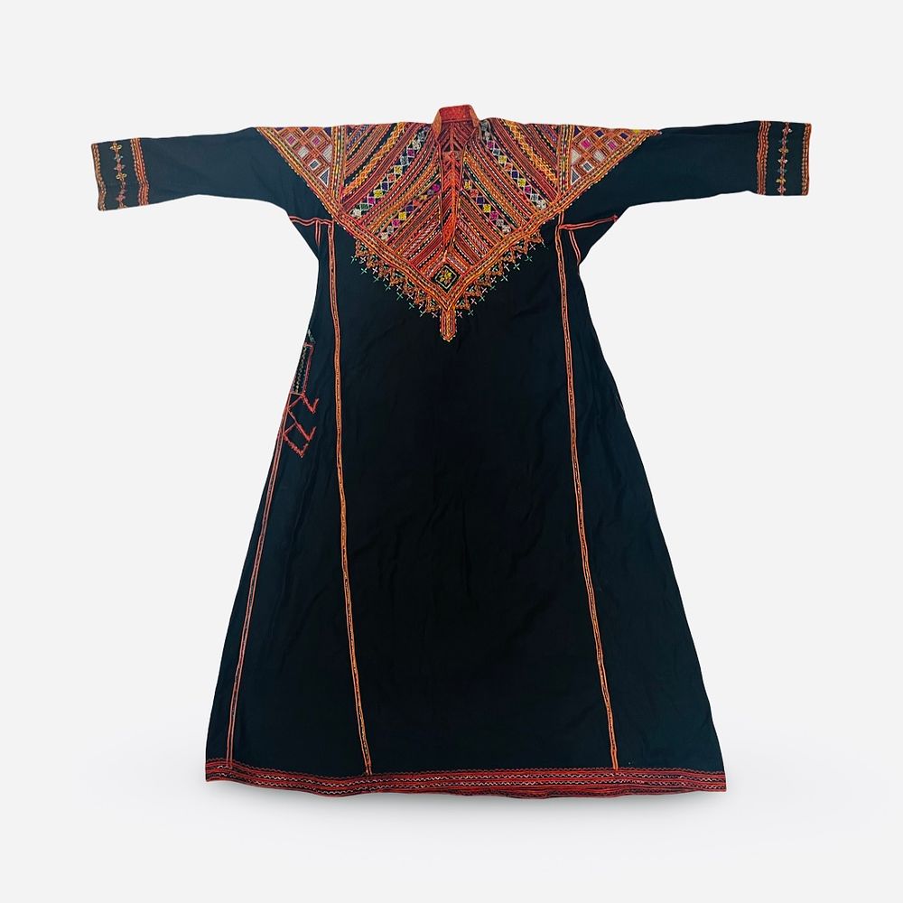 Lot 71: A SYRIAN OR PALESTINIAN THOBE DRESS WITH CORAL ORNAMENT, 20TH CENTURY